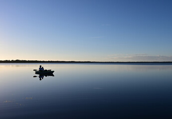 Active senior kayaking on Coot Bay in Everglades National Park, Florida on clear calm sunny winter afternoon.