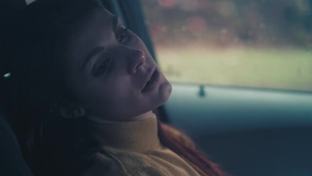 sorrow, unhappiness - depressed woman sitting in the car alone with lost eyes