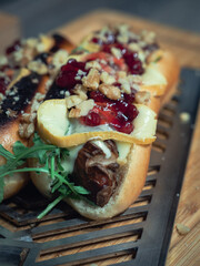 Hotdog with molten cheese, walnut and cranberries