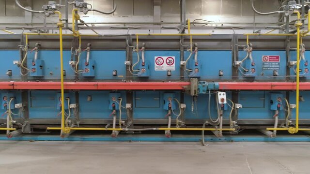 Tracking Shot Ceramic Tile Tunneling Kiln in a Factory