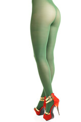 Back sexy view of standing slim young woman body  lower part wearing no lingerie in green tights and red high-heeled strip shoes on isolated white background