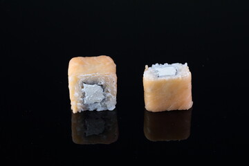 sushi on a black background