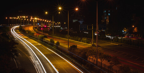 Fototapeta na wymiar turkey country, night city, highway long exposure vehicle light trails