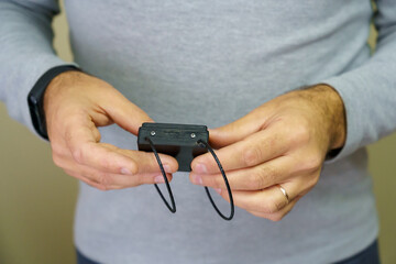 Electronic bracelet for criminals. Gadget for control and monitoring of the execution of punishment