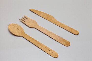 eco-friendly wooden cutlery icy on white background
