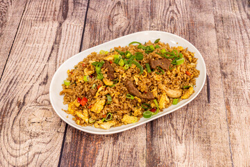 Arroz chaufa, or arroz de chaufa, is a fried rice-based dish that is consumed in Peru. It is part...