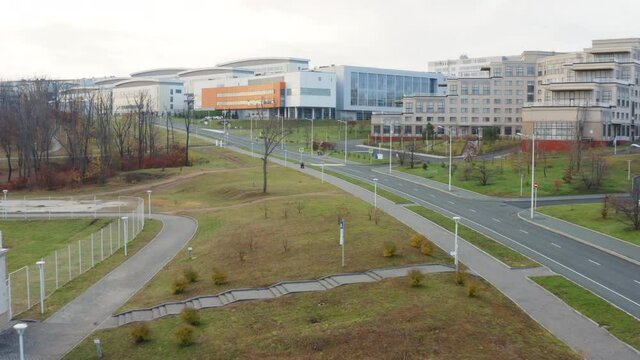 Flying above empty streets and roads, aerial view of campus buildings of Far Eastern Federal University. Almost no people due to coronavirus quarantine