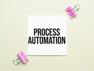 white paper with text Process Automation on a yellow backgroundd with stationery