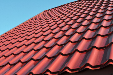 The roof of the house is covered with metal tiles