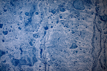 Blue paint on concrete walls covered with plaster.