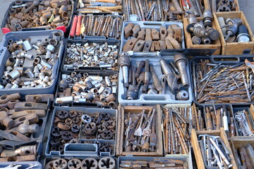 close-up showcasing old rusty metal and brass parts in bulk for decoration or collection, sold at a...