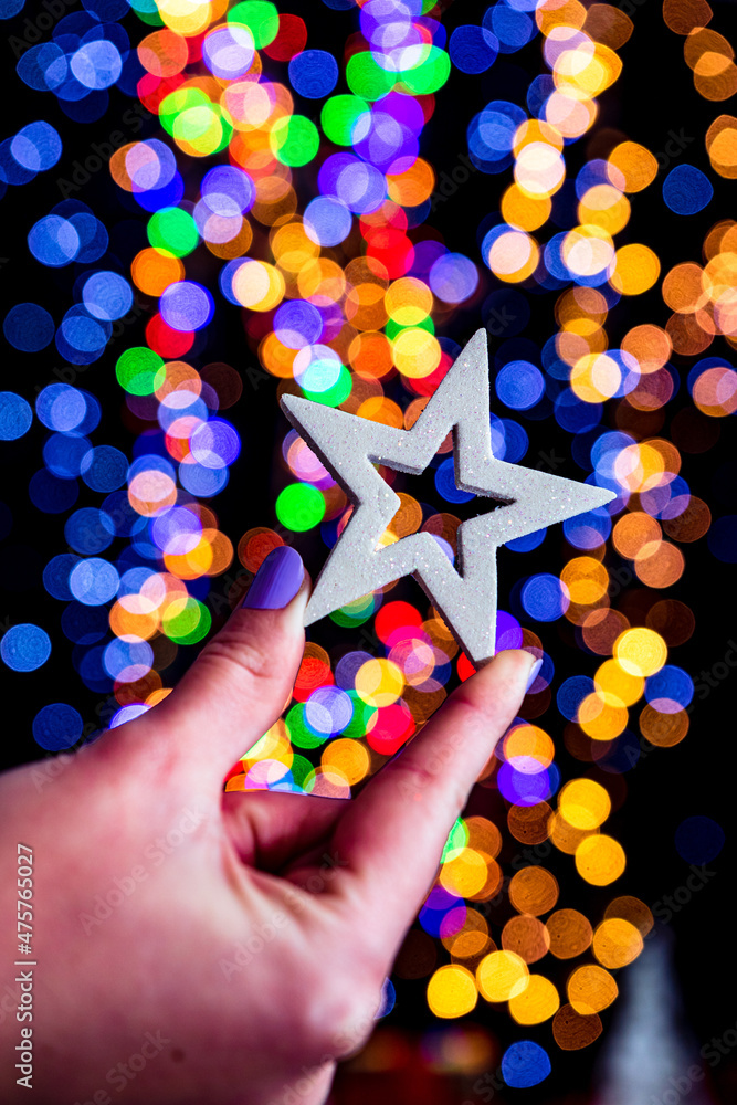 Canvas Prints Man holding a decoration against bokeh Christmas lights