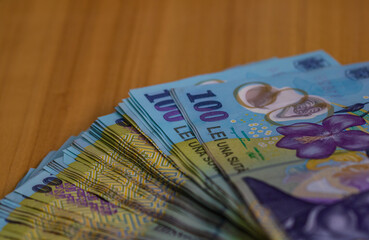 Closeup shot of LEI Romanian banknotes - inflation and economy concept