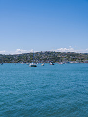 Fototapeta na wymiar Knysna town and waterfront from Thesen Island from water level