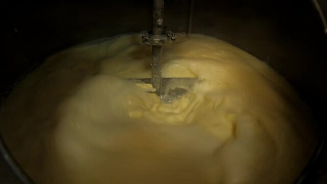 stirrer quickly mixes the flour in the wort kettle while making the whiskey mash 