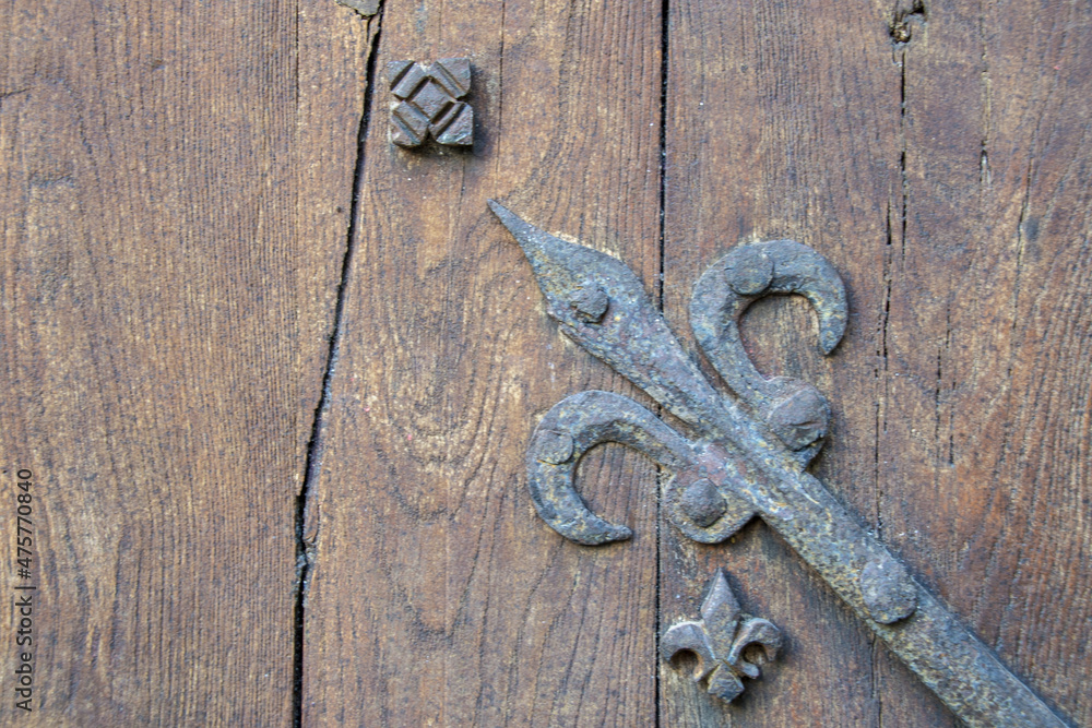 Wall mural Closeup of old brown wooden surface with the vintage metal details on it