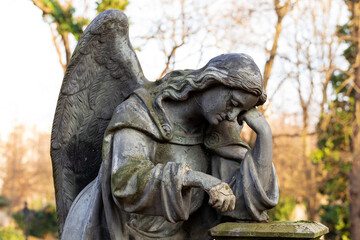 Obraz premium Historic Statue on the mystery old Prague Cemetery, Czech Republic