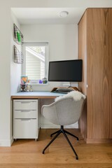A small home office with a computer