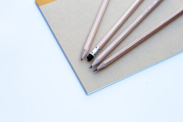 Pencil on notebooks or paper on white background
