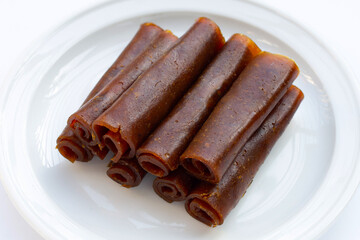 Dried mango paste on white background.