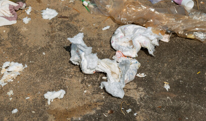 Disposable diaper waste in landfill. Environmental pollution.