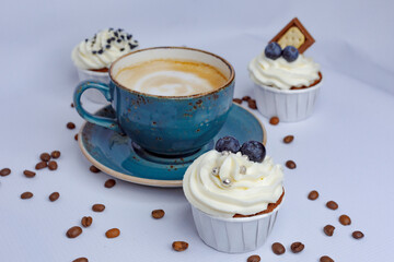 Chocolate cupcakes and coffee on craft paper