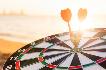 Closeup the dart arrow hit center on Bullseye(bull's-eye) of a dartboard is a target of challenge...