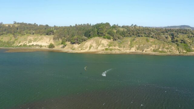 drone shot of person kitesurf in summer, chile, puertecillo and matanzas chile. skysurf kitesurfing chile