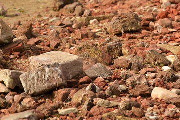 Broken bricks. Building material. Construction. The texture of broken bricks. Pouring the...