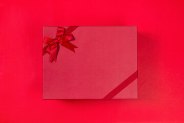 red gift box with satin bow isolated on white background