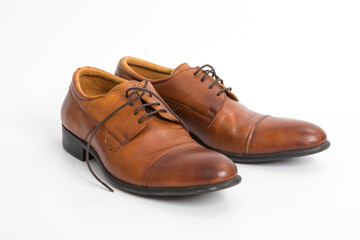 Brown leather mens shoes isolated on white background.