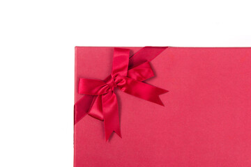 red gift box with satin bow isolated on white background