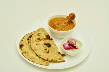 Plate of Butter Chicken and Roti with Chutney Onion Isolated on White Background
