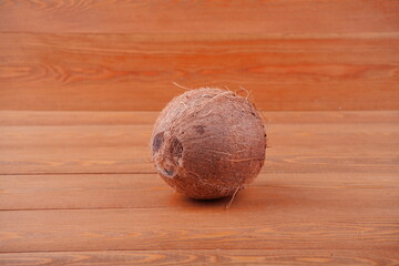 Coconut on a wooden background, top view. close-up. coconut and copy space. Free space for text. On a wooden background.