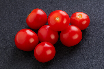 Ripe juicy cherry tomatoes heap