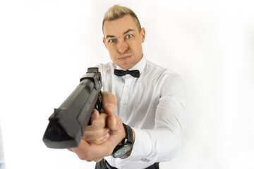 Man whith pistol, a cool man puffed out his cheeks, aiming a pistol on a white background