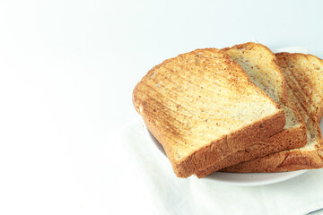 stack of toast on white plate and white placemat on white background, top view,isolate