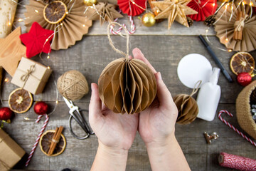 Do-it-yourself step-by-step instructions for a Christmas tree made of paper. Eco-style Christmas decor. Step 9.