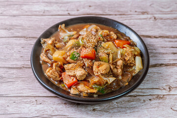 Andongjjimdak, Andong-style spicy stewed chicken : Originally from the Andong region, this dish consists of chicken, chili peppers, potatoes, clear noodles, leeks and carrots braised in a spicy sauce 