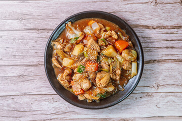 Andongjjimdak, Andong-style spicy stewed chicken : Originally from the Andong region, this dish consists of chicken, chili peppers, potatoes, clear noodles, leeks and carrots braised in a spicy sauce 