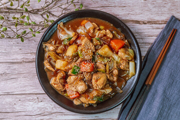 Andongjjimdak, Andong-style spicy stewed chicken : Originally from the Andong region, this dish consists of chicken, chili peppers, potatoes, clear noodles, leeks and carrots braised in a spicy sauce 