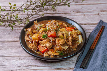 Andongjjimdak, Andong-style spicy stewed chicken : Originally from the Andong region, this dish consists of chicken, chili peppers, potatoes, clear noodles, leeks and carrots braised in a spicy sauce 