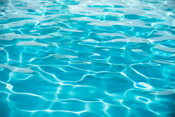 Water in swimming pool, background with high resolution. Wave abstract or rippled water texture.