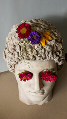 Statue of Alexander the great ornamented with colorful flowers