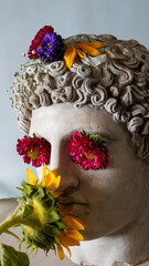 Statue of Alexander the great ornamented with colorful flowers