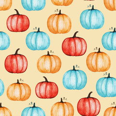Hand drawn seamless pattern of blue, red, orange pumpkins. Autumn natural harvest. Decorative colorful watercolor illustration for design card, invitation, wallpaper, wrapping paper, fabric