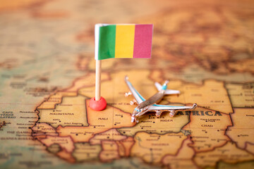 The flag of Mali and the plane on the world map.
