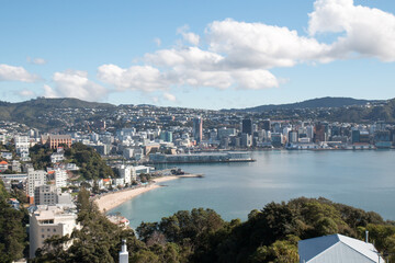 Wellington waterfront from Mount Victoria on a beautiful sunny day with a view over Oriental Parade and beach - obrazy, fototapety, plakaty