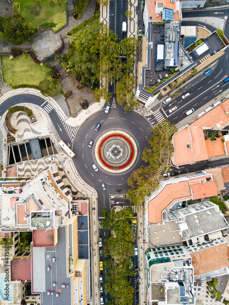 Wall mural Aerial shot of the Funchal city in Madeira, Portugal, with the central roads and the buildings