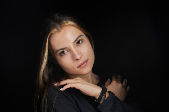 A lady in a casual, dark T-shirt. Portrait, young lady